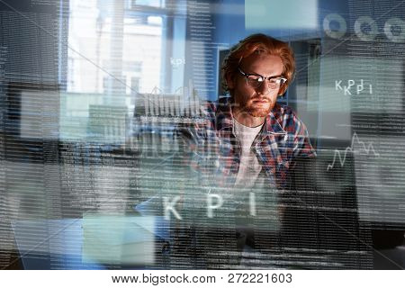 Young Concentrated Computer Developer Writing New Code