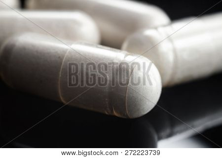 White Medical Capsules Of Glucosamine Chondroitin, Healthy Supplement Pills, Macro Image.