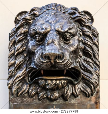 Havana / Cuba: The Head Of Bronze Lion Stated On The Wall Of Local Post Office. Outdoors, Close Up, 