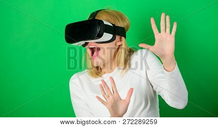 Confident Young Woman Adjusting Her Virtual Reality Headset And Smiling. Excited Smiling Businesswom