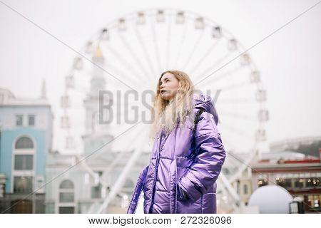A Beautiful Girl By The Ferris Wheel At Kontraktova Square In Kiev, Ukraine. December 4, 2018
