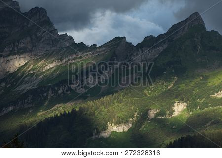 Alpine Scenery With Mountain Peaks And Slope In Sunset Light