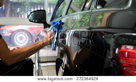 Two Specialist Dries The Car From Moisture, Car Washing. Concept: Drying Machines, Professionals, Au