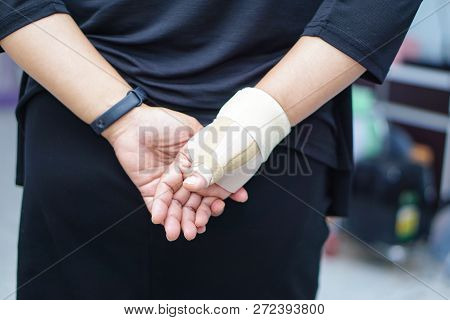 Asian Middle-aged Lady Woman Use Elastic Bandage To Treating De Quervain Syndrome At Hand And Finger