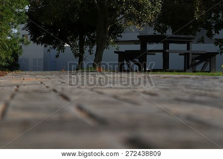 A Photo Of A Bench Taken From Ground Level Made Of Bricks