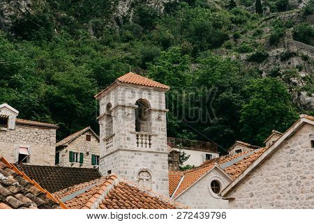 Beautiful View Of The Bell Tower Of The Orthodox Church In Kotor In Montenegro. Religious Building. 