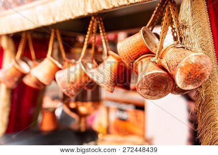 Close Up Of A Bunch Of Copper Coffee Pots Hanged Up In A Market In Istanbul