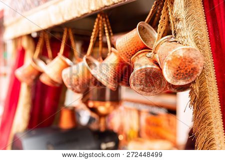 Close Up Of A Bunch Of Copper Coffee Pots Hanged Up In A Market In Istanbul