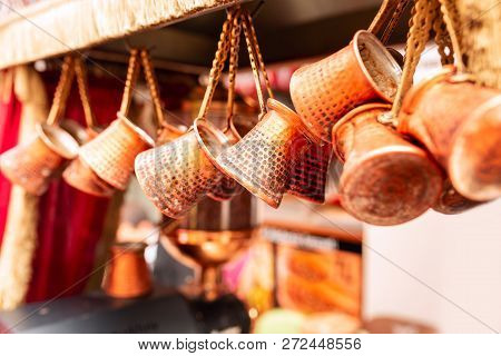 Close Up Of A Bunch Of Copper Coffee Pots Hanged Up In A Market In Istanbul