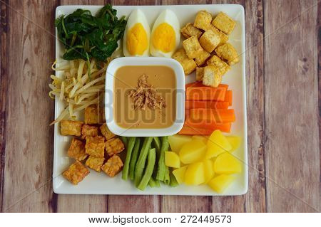 Gado-gado, Traditonal Indonesian Food. Boiled Vegetable, Egg, Tempeh, Tofu And Potato Served With Pe