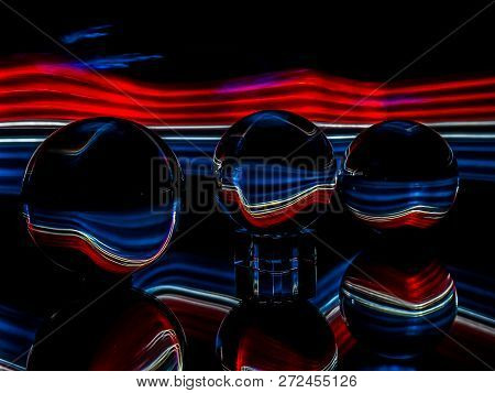 Luminescent Painting Provide Reflections In The Glass Orbs.