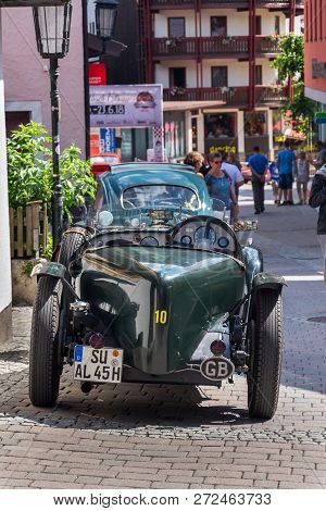 Saalbach-hinterglemm, Austria - June 21 2018: Vintage Alvis Oldsmobile Veteran Car Standing On Stree