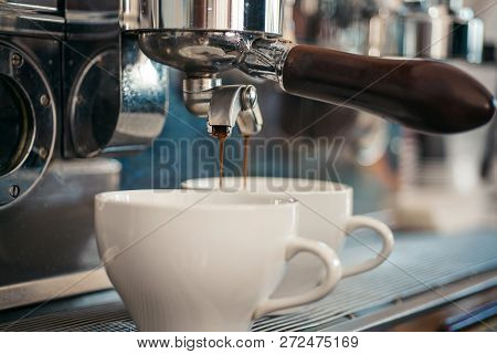 Enjoy Barista Style Coffee. Coffee Being Brewed In Coffeehouse Or Cafe. Espresso Making With Portafi