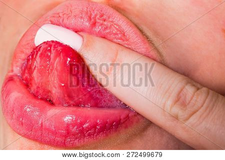 Beautiful Female Lips Lick Finger. Sweets And Tasty Food Concept. Aphrodisiacs. Kink. Tongue In Fema