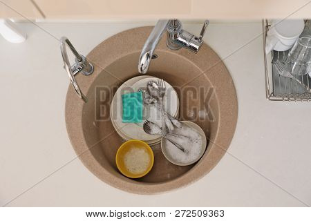 Heap Of Dirty Dishes In Kitchen Sink, Top View. Cleaning Chores