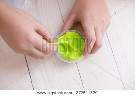 Children Mold Homemade From Stiffening Clay. Fun In The Winter In Cold Weather At Home. Simple Figur