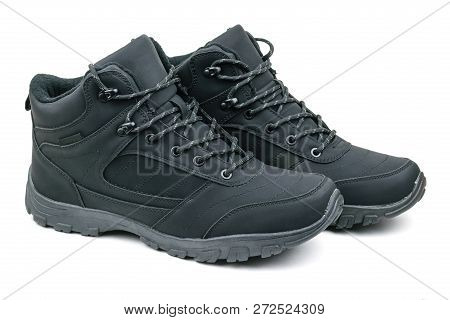 A Pair Of Insulated Black Mens Sports And Travel Boots Isolated On White Background.