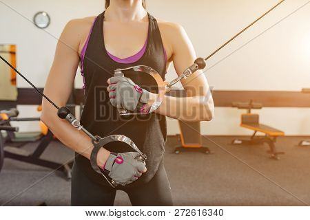 Woman Holding Metal Ring And Doing Lunges Exercises For Hands Muscle Workout Training In Gym.