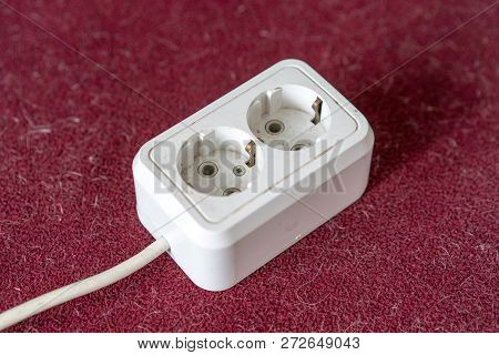 Electric Extension  On Cherry Background. Powerboard Isometric With 2 Slots