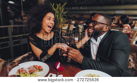 African Handsome Man Proposing To Girlfriend. Romantic Couple In Love Dating. Cutel Man And Girl In 