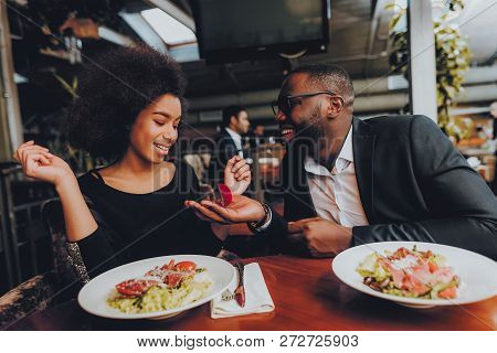 African Handsome Man Proposing To Girlfriend. Romantic Couple In Love Dating. Cutel Man And Girl In 