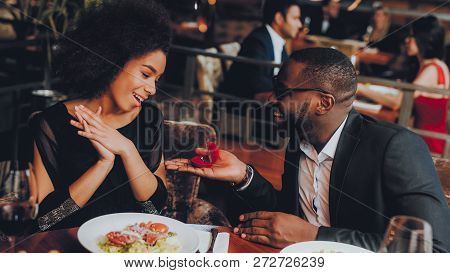 African Handsome Man Proposing To Girlfriend. Romantic Couple In Love Dating. Cutel Man And Girl In 