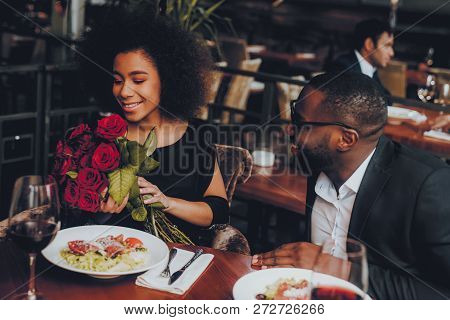 African American Couple Dating In Restaurant. Romantic Couple In Love Dating. Cutel Man And Girl In 