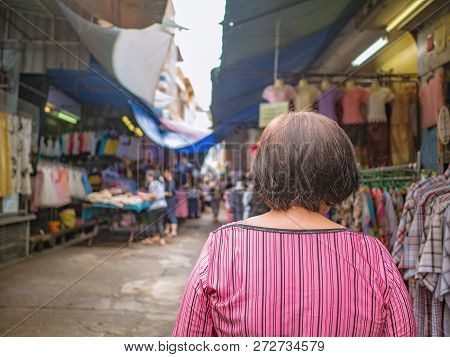 Back Of Senior Asian Women Walking And Shopping On 