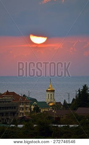 Sunset Over A Small Southern City On The Black Sea Coast. The Village Of Golovinka (lazarevsky Distr