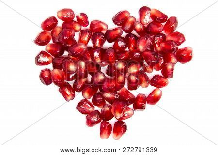 Red Heart Of Grenades. Big Ripe Red Granets Or Garnets. Fruits Of Red Ripe Pomegranate On The White