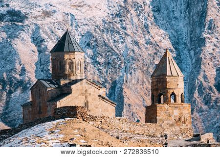 Stepantsminda, Gergeti, Georgia. Famous Gergeti Trinity Tsminda Sameba Church In Early Winter.