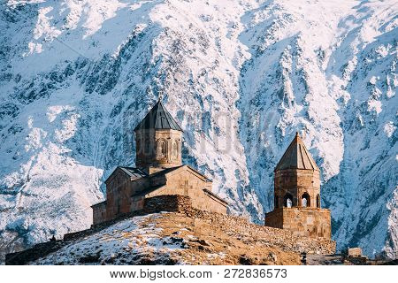 Stepantsminda, Gergeti, Georgia. Famous Gergeti Trinity Tsminda Sameba Church In Early Winter.