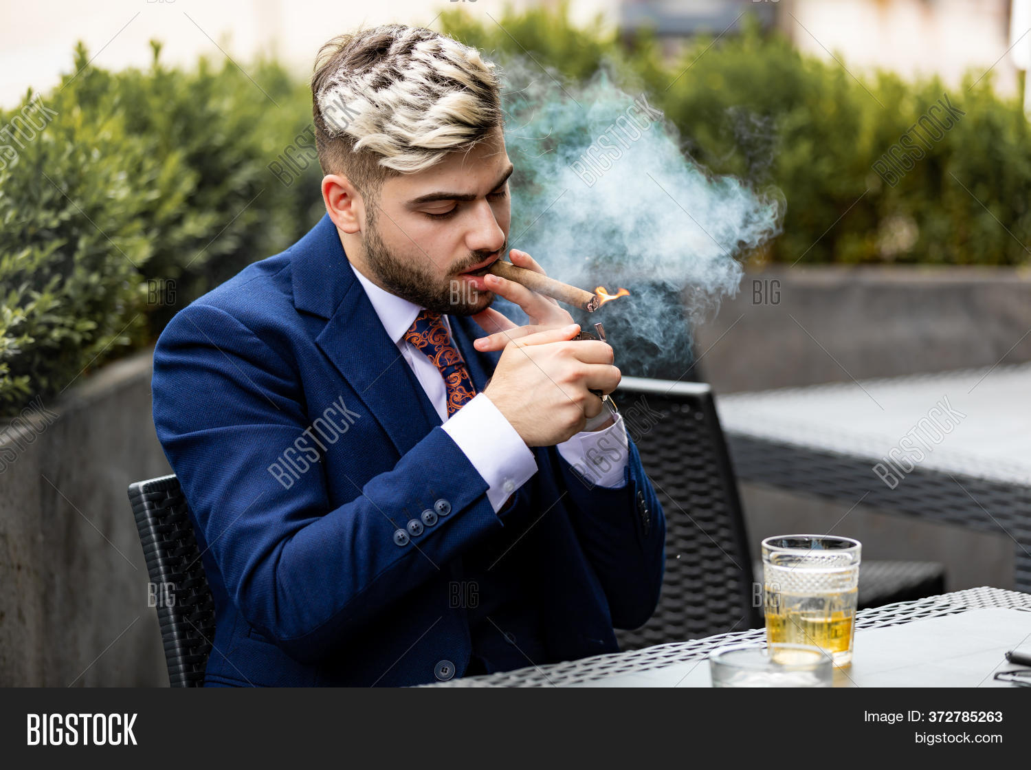 handsome man smoking cigarette Stylish Handsome Man Image & Photo (Free Trial)