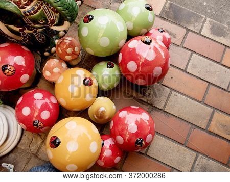 Colorful Stucco Mushrooms For Decorate Sale In A Shop
