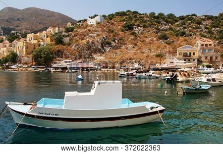 Symi, Greece - June 14, 2020: Fishing Boats In The Port Of Symi Town, Symi Island, Greece