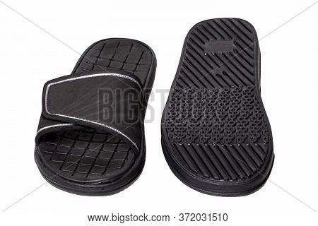 Close-up Of A Pair Of Black Rubber Sandals Or Slippers For The Shower Swimming Pool Or Beach With Sl