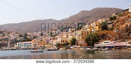 Symi, Greece - June 05, 2020: Symi Town, Symi Island, Pictorial View Of Colorful Houses And The Harb