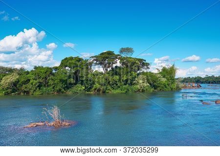 Beautiful Calm Iguazu River, View Of Trees On Small Islands On The River In Iguasu National Park On 