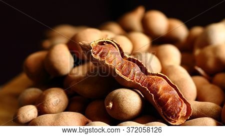Fresh Tamarind Fruits.sweet Ripe Tamarinds On Dark Background.