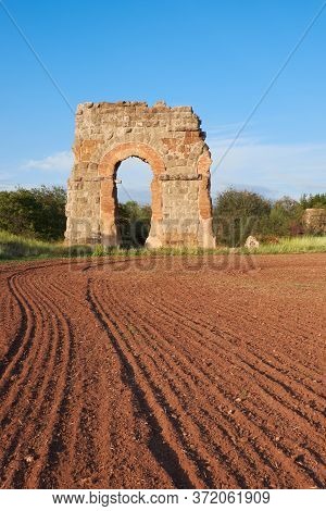Ruins Of The Ancient Aqueduct Near Villa Quintili On Appia Way In Rome, Italy