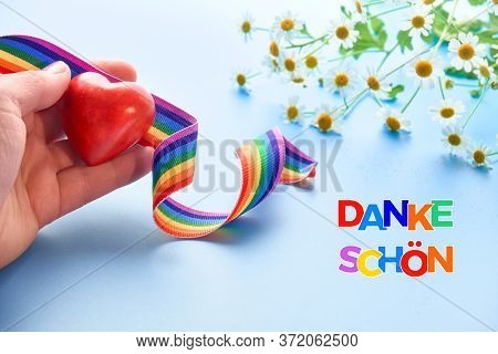 Rainbow Text Danke Shon In German Language Means Thank You In English. Red Heart And Rainbow Ribbon.