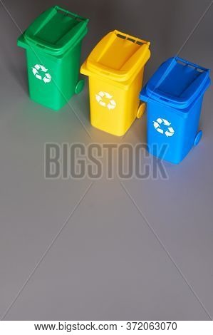 Three Color Coded Recycle Bins, Isometric Projection On Grey Paper Background With Copy-space. Recyc