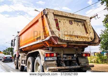 Traffic With Road View Through Car Front Window, Dirty Schmitz Cargobull Tipper Trailer Truck In Tra