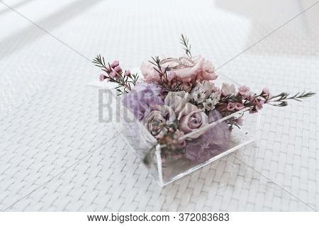 Wedding Rings Close Up Photo In Wedding Box With Flowers