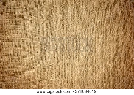 Old Brown Coarse Burlap Canvas Texture Background.