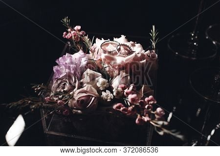 Wedding Rings Close Up Photo In Wedding Box With Flowers