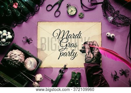 Creative Halloween Or Mardi Grasss Background In Purple, White And Black. Text Mardi Grasss Party On
