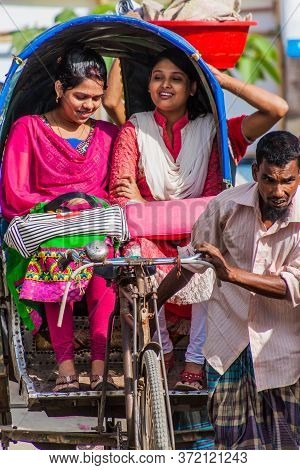 Bogra, Bangladesh - November 7, 2016: Local Girls Riding In A Rickshaw In Bogra, Bangladesh.