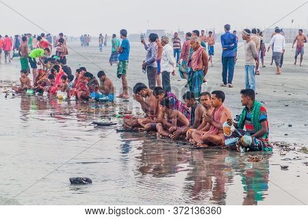 Dublar Char, Bangladesh - November 14, 2016: Hindu Devotees Praying Before Their Holy Dip During Ras