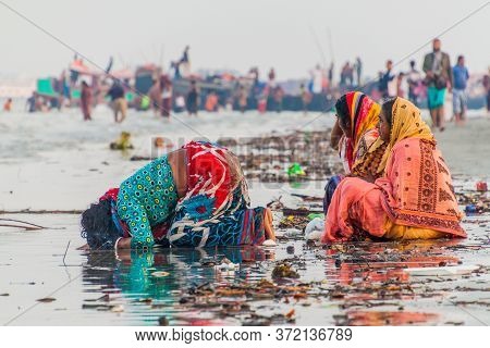 Dublar Char, Bangladesh - November 14, 2016: Hindu Devotees Praying Before Their Holy Dip During Ras